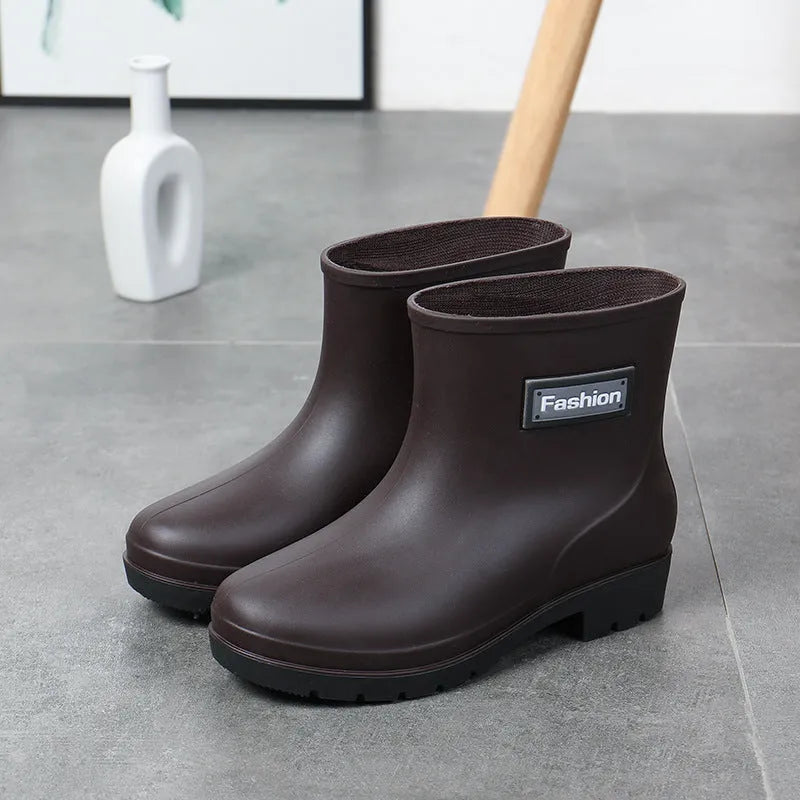 Women's PVC mid-calf rain boots in black with low heel, size 36-40