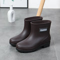 Women's PVC mid-calf rain boots in black with low heel, size 36-40