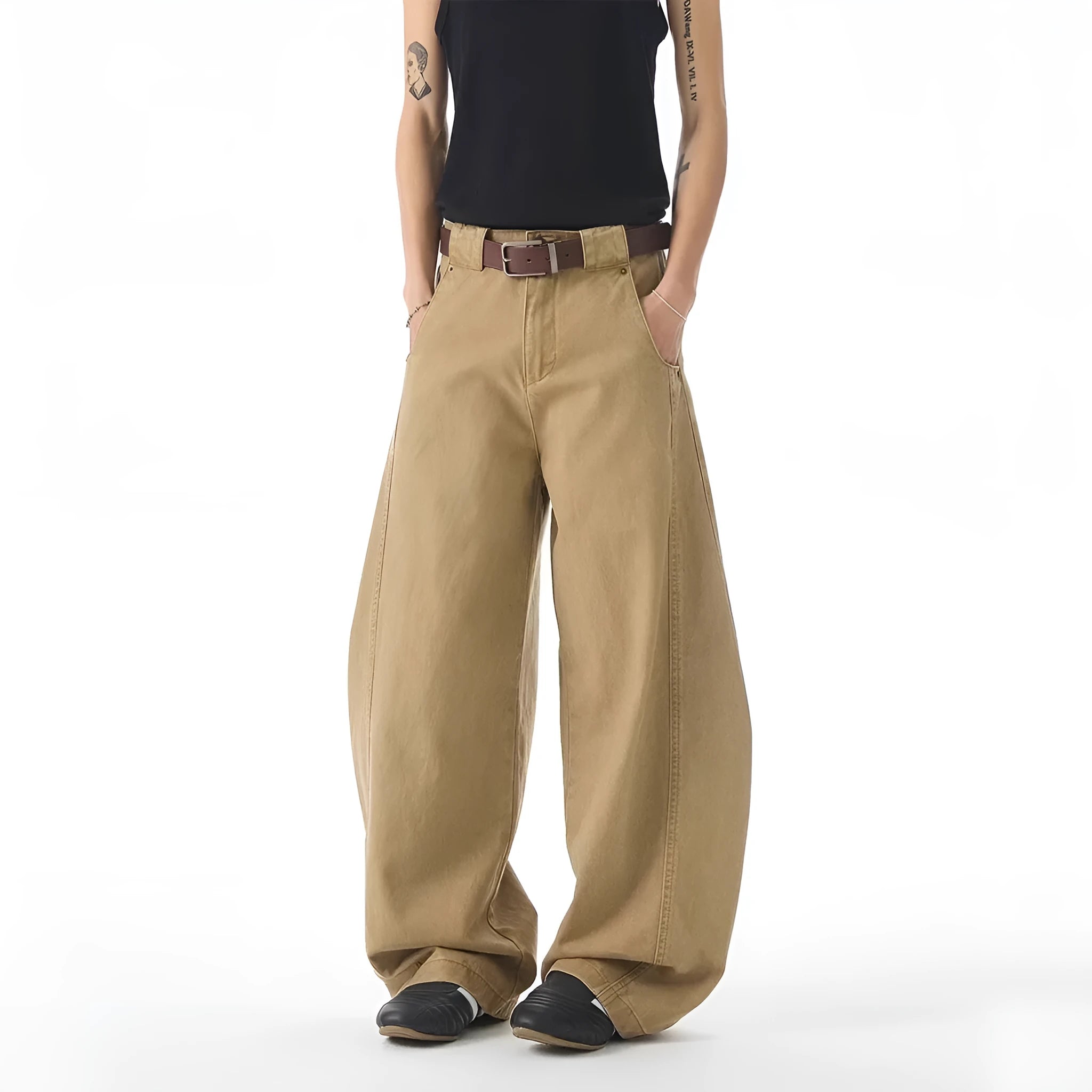 Brown men's loose-fit straight leg denim jeans with a button fly on a neutral background.