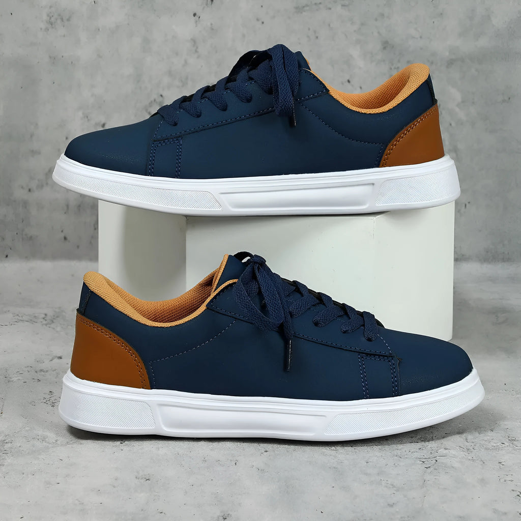 Beige brown platform casual sneaker with cross-belt detail and a low-top silhouette on a white background.