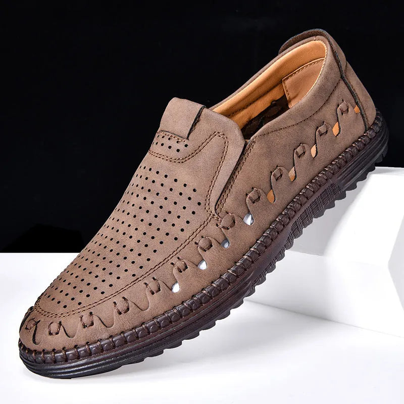Men's brown slip-on casual shoes with round toe and sewing line detailing on flat PVC sole