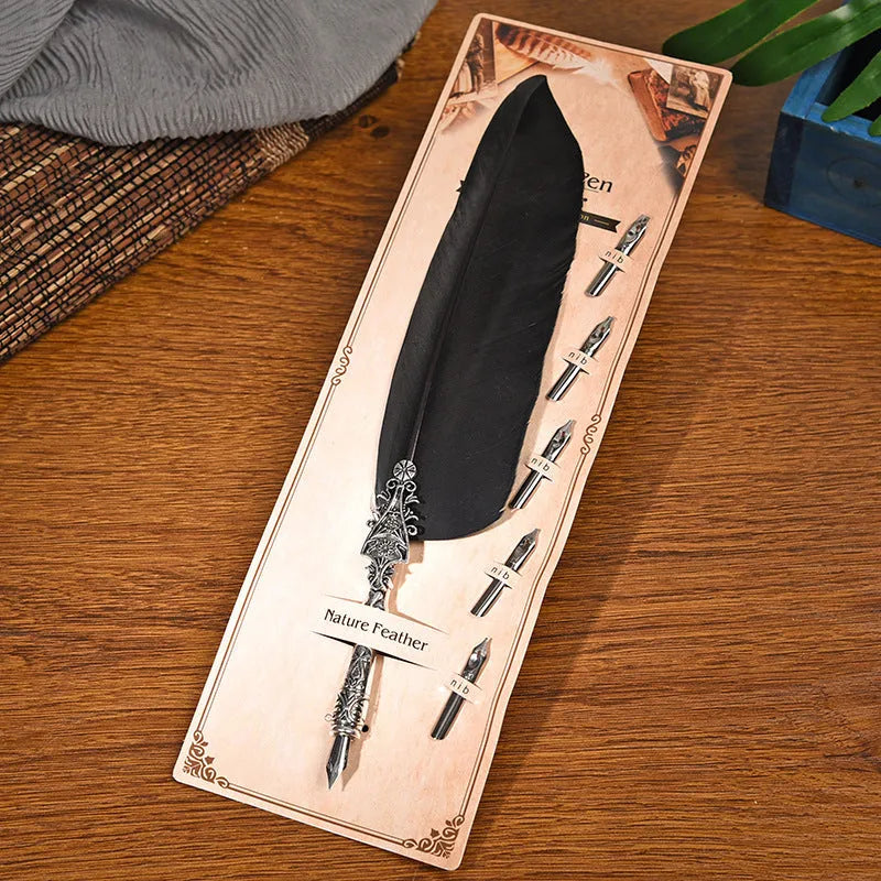 Vintage feather dip pen with zinc alloy shell in a choice of ten colours on a desk.