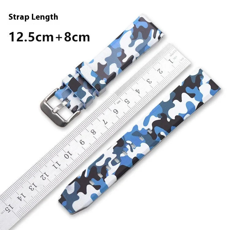 Green camouflage silicone watch strap with flat head lugs shown next to blue and grey versions.