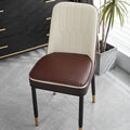 Leather horseshoe-shaped seat cushion on a chair, showing non-slip base and solid colour.