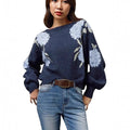 Women's loose-fit sapphire blue pullover with white flower jacquard pattern and long sleeves.