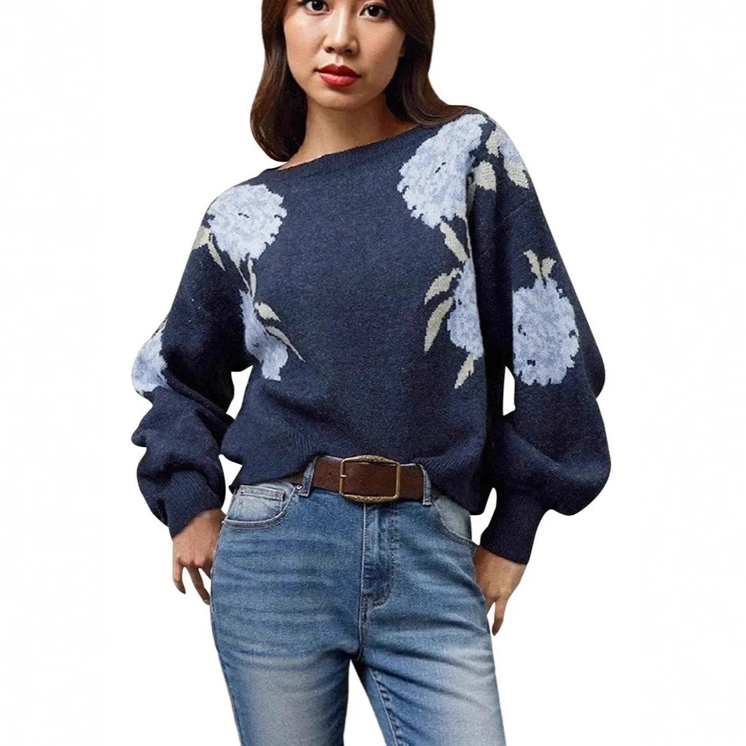 Women's loose-fit sapphire blue pullover with white flower jacquard pattern and long sleeves.