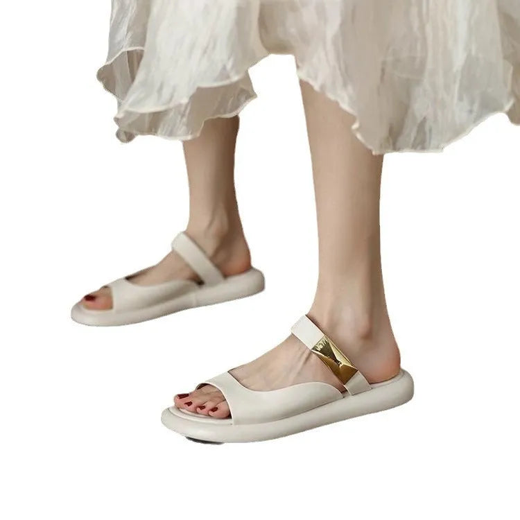 Apricot peep toe flat sandals with a platform sole and leather upper