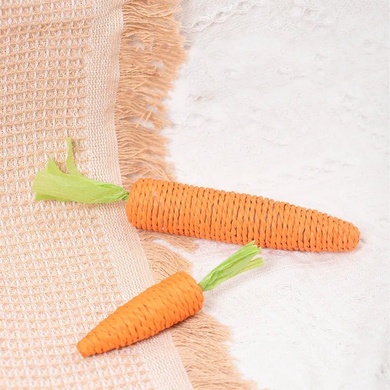 Cat toy set with carrot-shaped chew toys, crinkly paper toys, ringing stones, interactive sticks, and tooth grinding items
