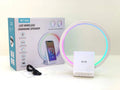 White smart Bluetooth speaker with built-in ambient light and 15W wireless charging pad on top.