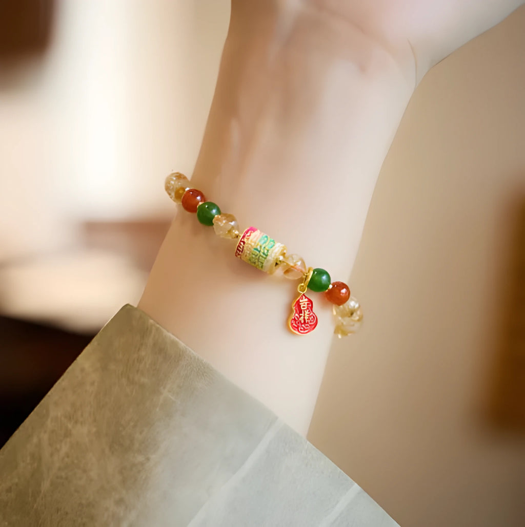 Citrine five sutra hand-woven crystal bracelet with geometric design on neutral background