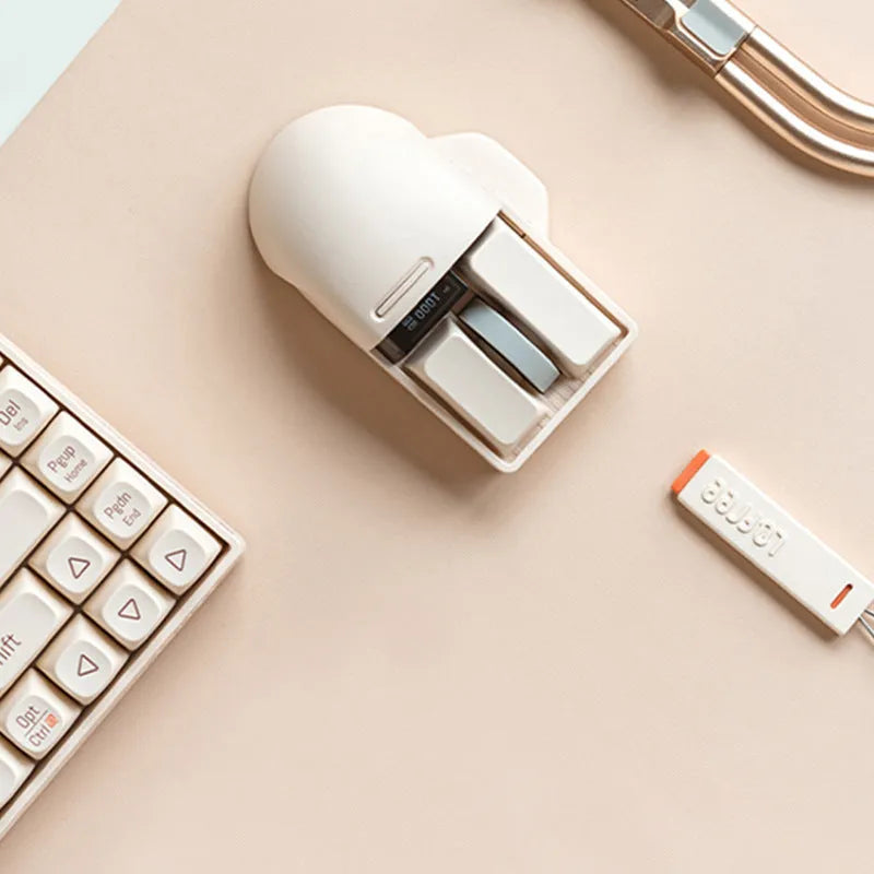 Xiaoqiao Tofu colour wireless mouse with 7 buttons and scroll wheel on plain background