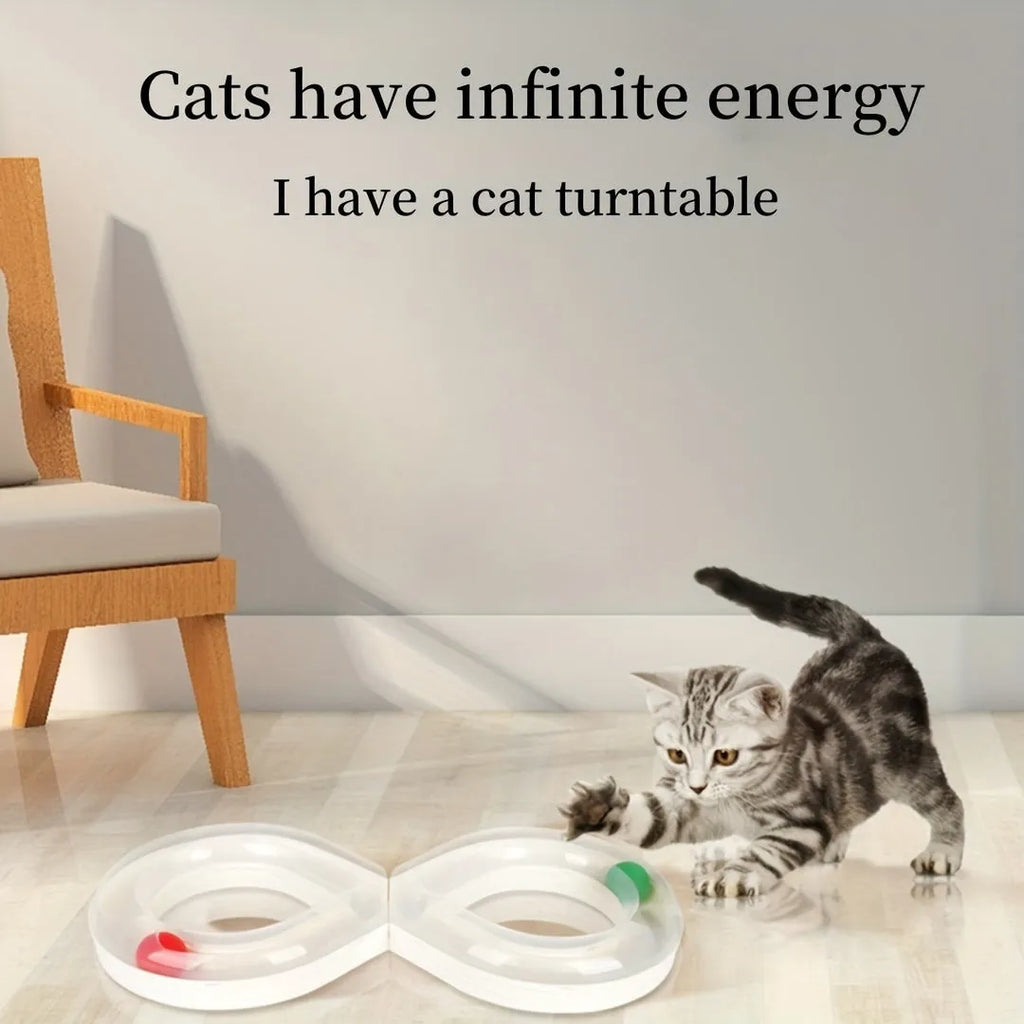 Blue and white cat toy set with a turntable track ball and a teasing stick on a floor.