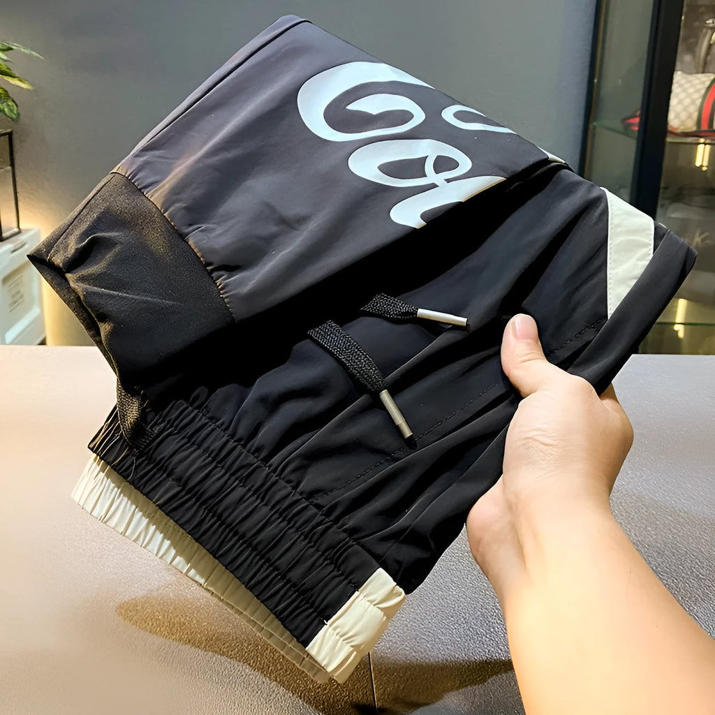 Black men's casual cropped trousers with ankle band made from ultra-thin ice silk and cotton.