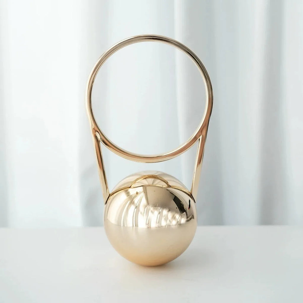 Round hard-shell PVC dinner bag with ball electroplating handle, 25x11x15cm, in silver with stitching detail and slit pocket