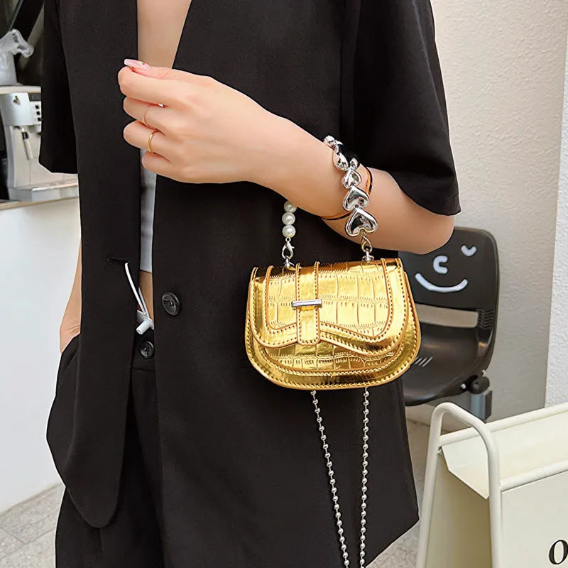 Mini crossbody bag in PU leather with mobile phone pocket, shown in silver colour with horizontal square design
