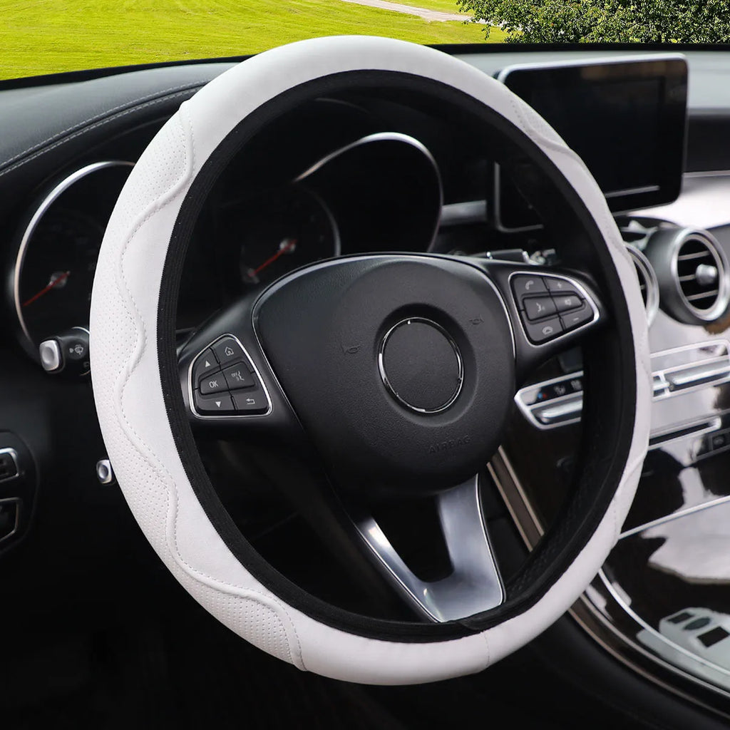 Embossed corrugated elastic steering wheel cover in black with textured surface pattern