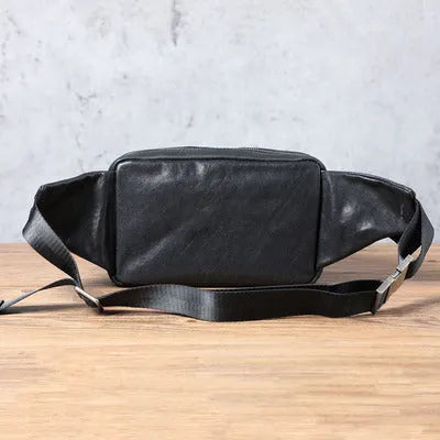 Men's small black head layer cowhide cross-body backpack with zip closure and single shoulder strap