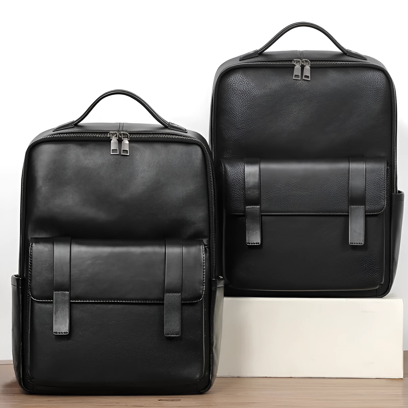 Large black genuine leather men's computer backpack with back support plate.