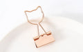 Golden decorative alligator clip with choice of flamingo, love, clouds, cat, cactus, or bow motif designs