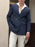 Man wearing a classic striped double-breasted polyester blazer jacket.
