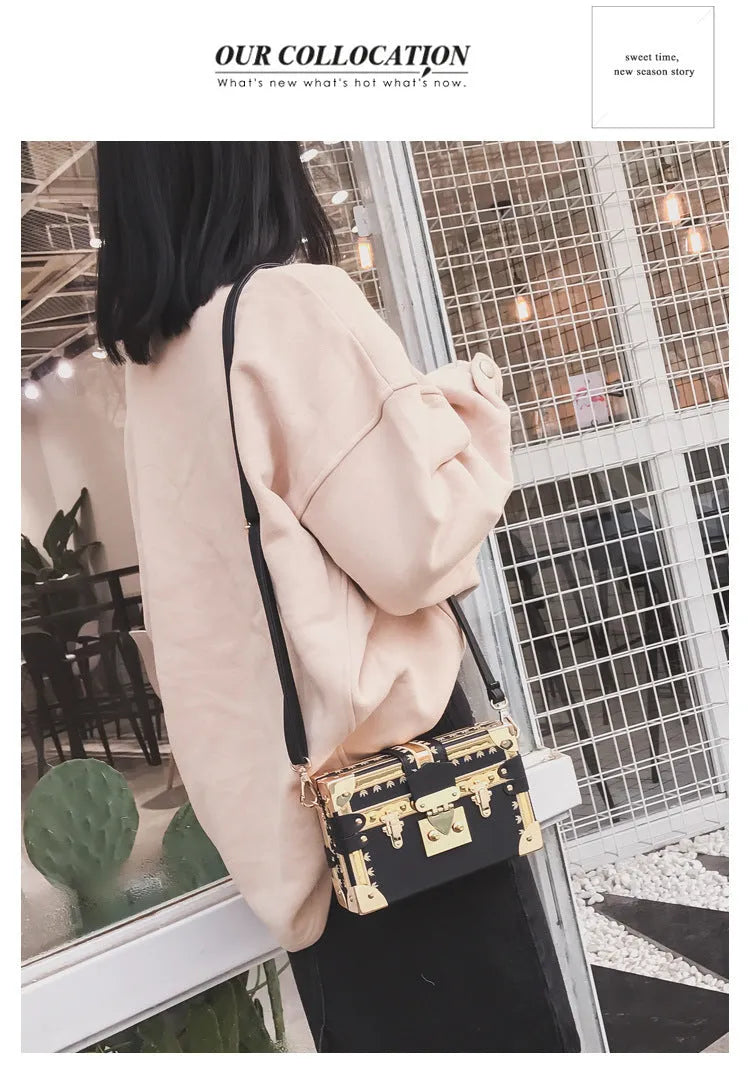 Hard-shell women's shoulder bag with single strap, flap closure, and decorative rivet details in black or green colour