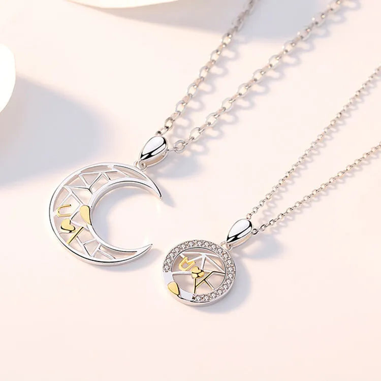Copper sun and moon tooth couple necklace with electroplated finish on cross chain.