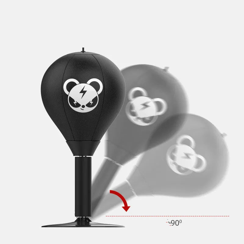 Tabletop boxing speed ball with black PU leather inflatable ball on desk using suction cup base for reflex training and stress relief.