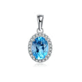 Women's sterling silver jewellery set with blue topaz gems featuring geometric earrings, ring, necklace and pendant