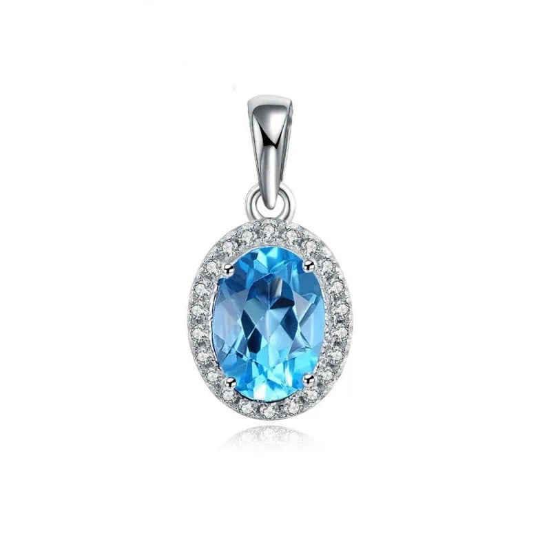 Women's sterling silver jewellery set with blue topaz gems featuring geometric earrings, ring, necklace and pendant