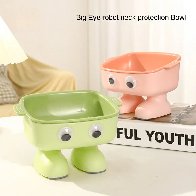 Green elevated cat bowl with robot shape design on anti-slip base showing tilted angle for feeding