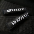 Black car seatbelt shoulder pad made of sponge cloth and cotton, showing embroidery weave detail.