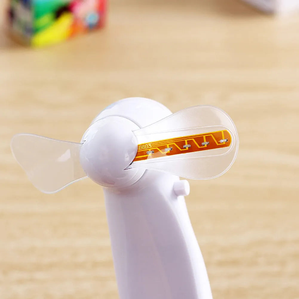White handheld mini fan with flashing blue and red I love you LED display
