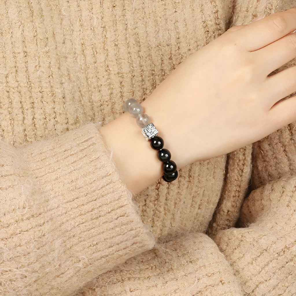 Polished crystal bracelet in khaki with 10mm geometric beads on a neutral background
