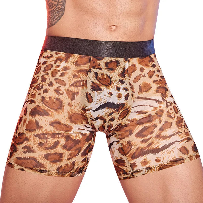 Men's leopard print boxer shorts on flat surface showing animal print pattern