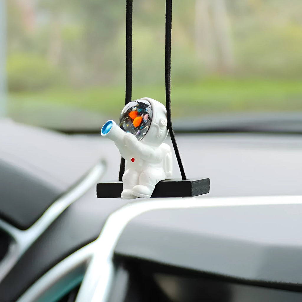 Resin astronaut car pendant with hand-painted cartoon designs in five colour variations
