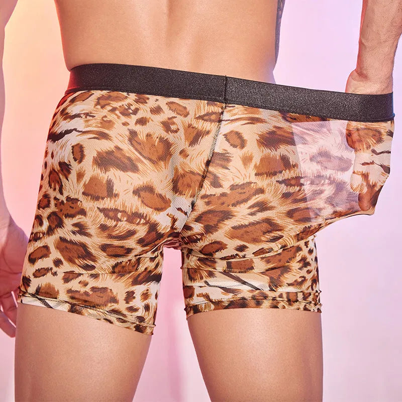 Men's leopard print boxer shorts on flat surface showing animal print pattern