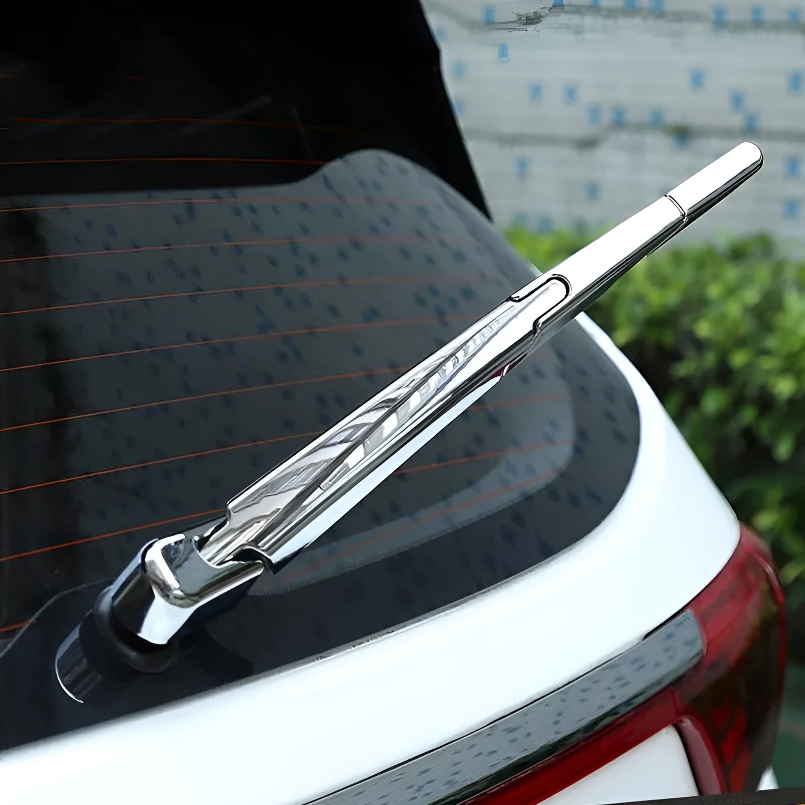 Set of four silvery ABS plastic rear window wiper cover strips for a 2010 Hyundai.