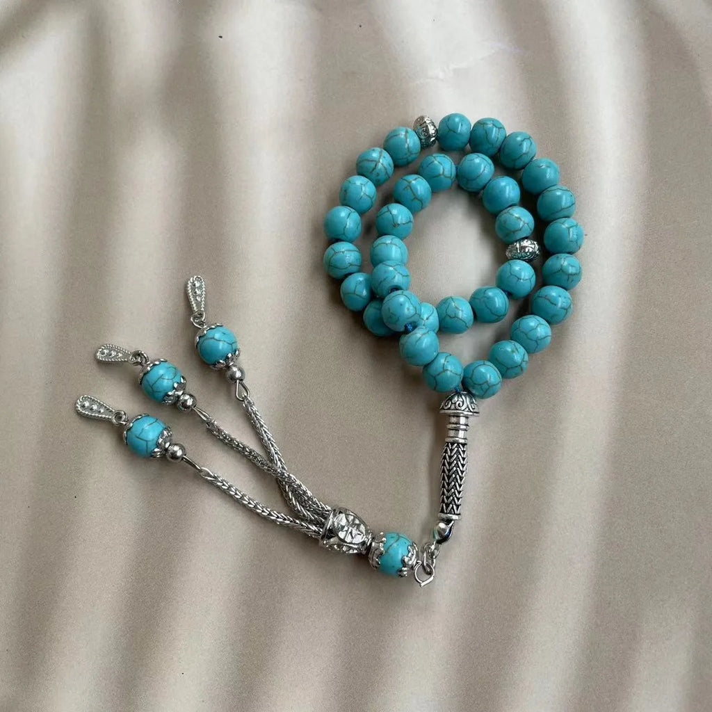 Handmade sky blue stone Muslim prayer bracelet with 8mm beads on wrist.