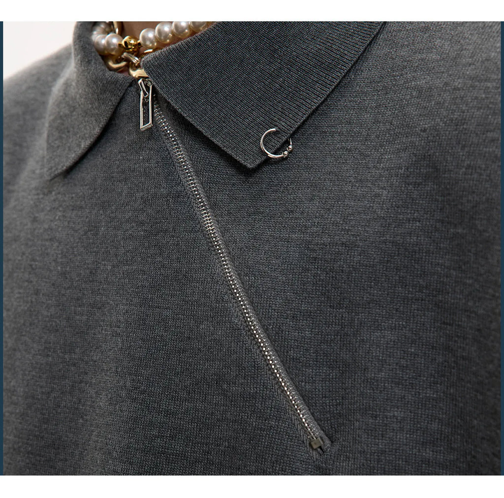 Men's black slim-fit knitted polo shirt with an oblique diagonal zipper and short sleeves.