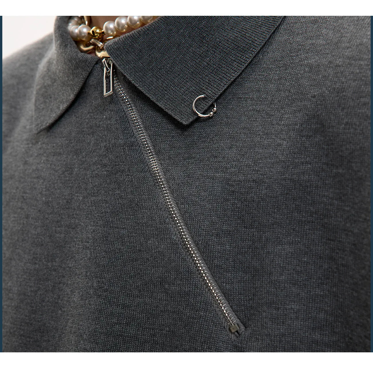 Men's black slim-fit knitted polo shirt with an oblique diagonal zipper and short sleeves.