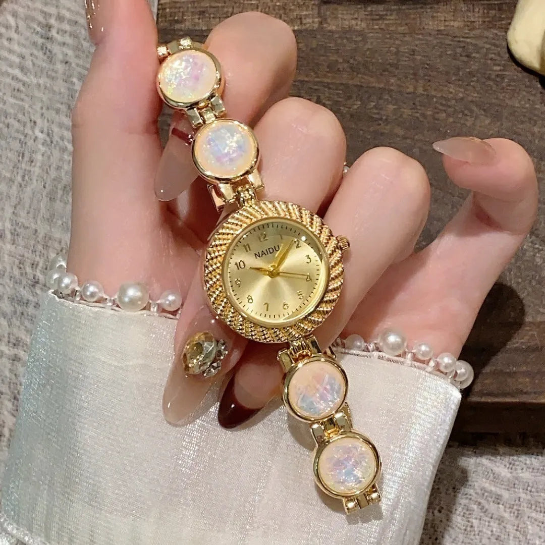 Women's 25mm round quartz watch in zinc alloy case, shown in various colours.