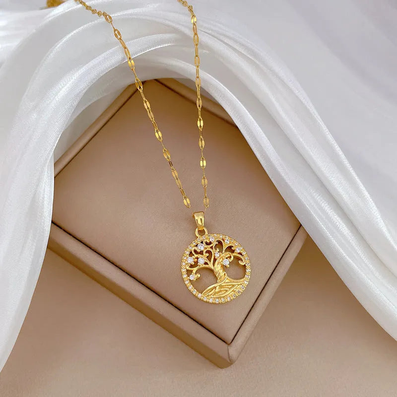Gold-plated necklace with a detailed rhinestone lucky tree pendant on a Mother Pearl base.