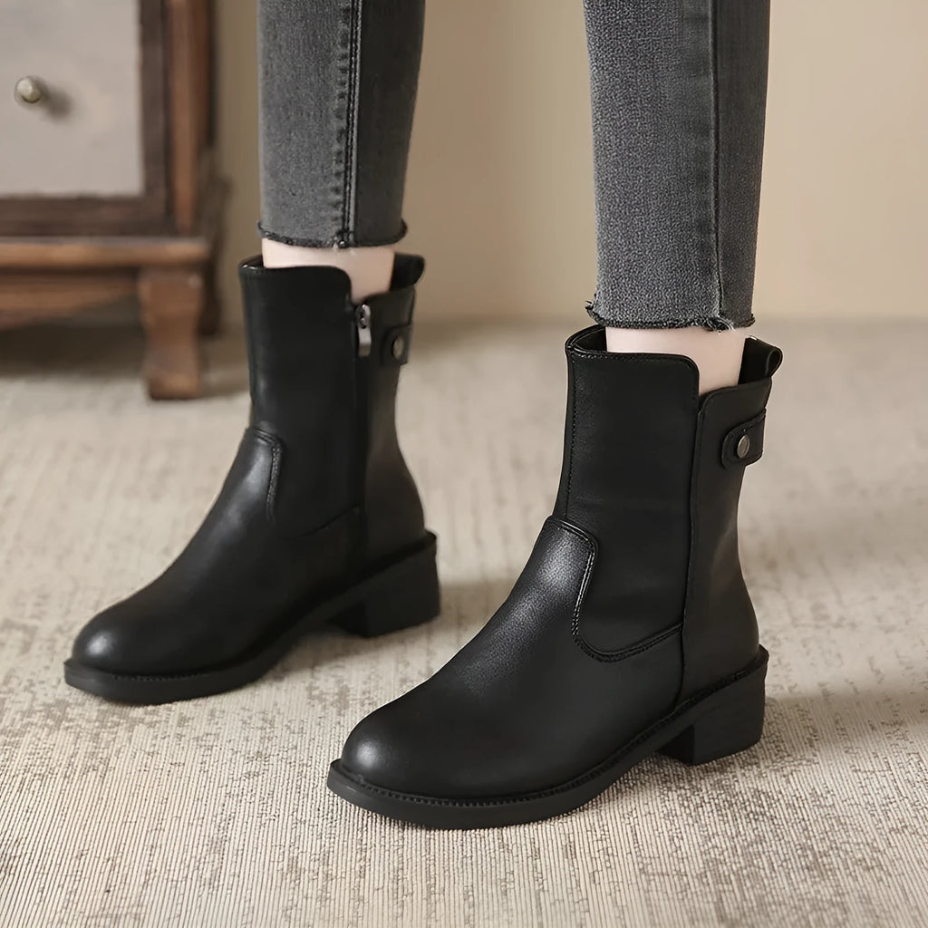 Black women's low heel ankle boots with side zip fastening and round toe design