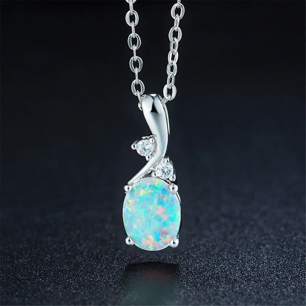 Water drop opal pendant necklace on an adjustable O-chain in rose gold or white.