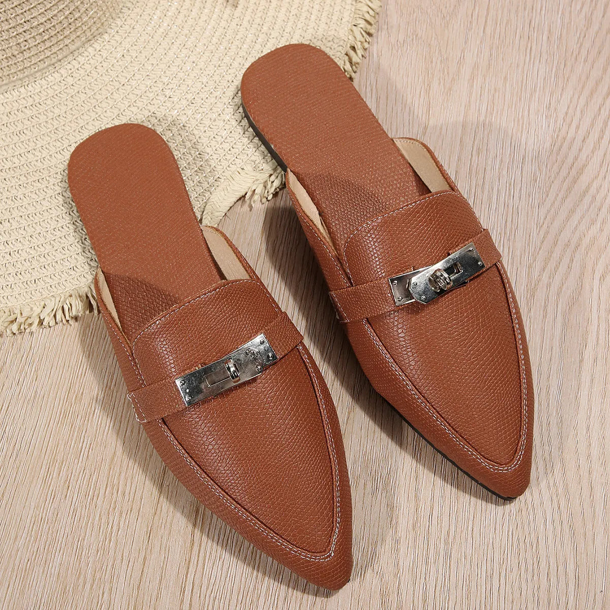 Light brown women's pointed-toe low heel casual semi-slippers on a neutral background