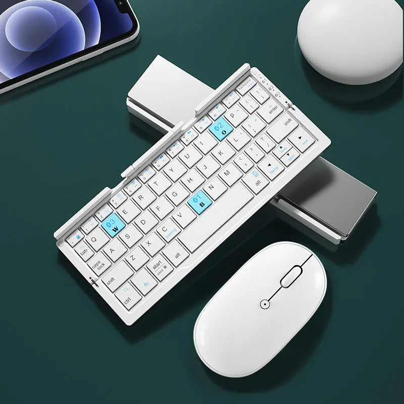 Silver white folding Bluetooth keyboard open beside smartphone showing aluminium stand