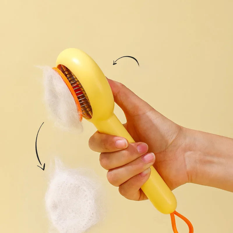 Small yellow duck-shaped pet grooming comb with needle head for hair removal on cats and dogs.