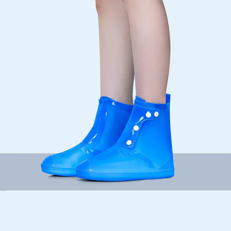 White high-top PVC reusable shoe covers for women, shown with size chart.