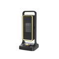 Black desktop PTC ceramic fan heater with control knob, shown on a table.