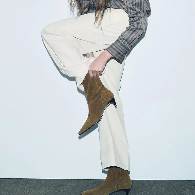 Brown square toe high heel boots with side zipper and a kitten heel on a waterproof platform sole.